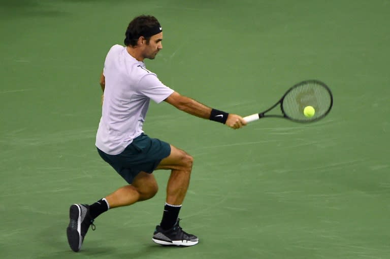 Roger Federer of Switzerland hits a return against Rafael Nadal of Spain during their men's singles final match at the Shanghai Masters tennis tournament in Shanghai on October 15, 2017