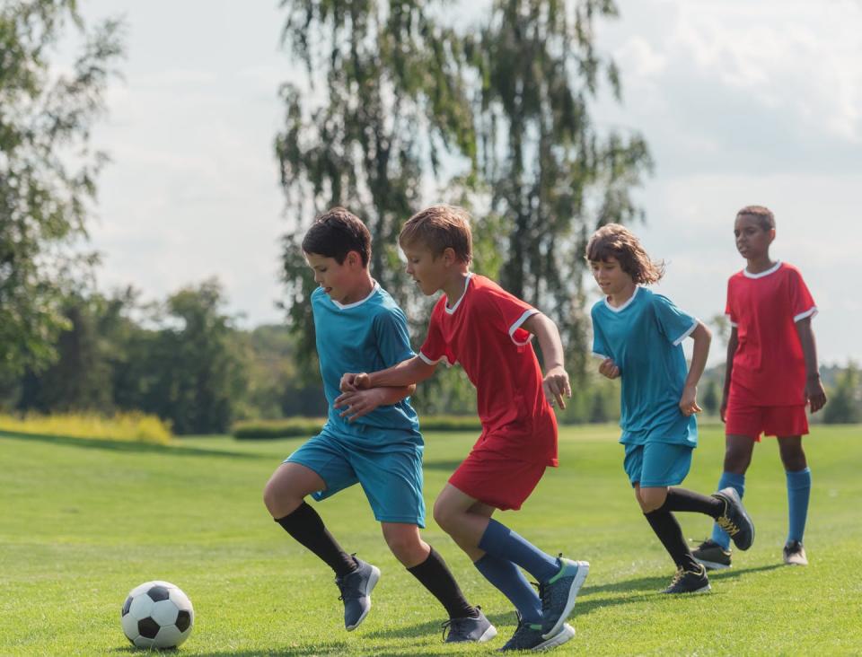 <span class="caption">Kids running up and down a soccer field can burn a lot of calories, but that expenditure can be negated by sugary or other unhealthy snacks.</span> <span class="attribution"><a class="link " href="https://www.shutterstock.com/image-photo/four-multicultural-kids-playing-football-on-1505467880" rel="nofollow noopener" target="_blank" data-ylk="slk:LightField Shudios/Shutterstock.com;elm:context_link;itc:0;sec:content-canvas">LightField Shudios/Shutterstock.com</a></span>