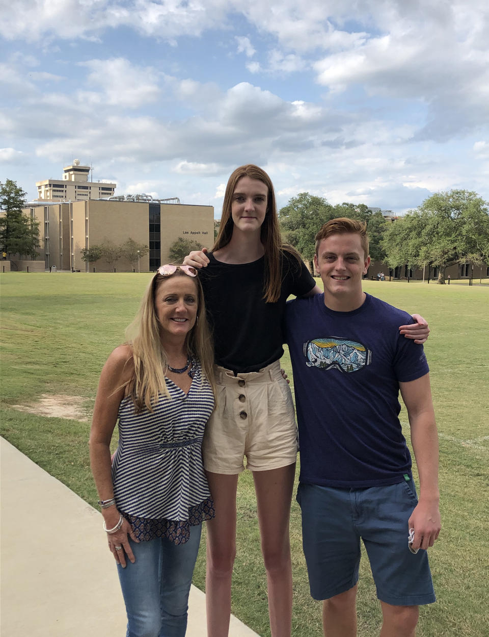 Maci, center, stands with her mom Trish Currin and brother Jake. (Courtesy Currin family)