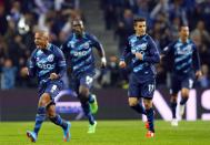 Porto's Yacine Brahimi (L) celebrates his goal against FC Basel with his teammates during their Champions League round of 16 second leg soccer match at Dragao stadium in Porto, March 10, 2015. REUTERS/Miguel Vidal (PORTUGAL - Tags: SPORT SOCCER)