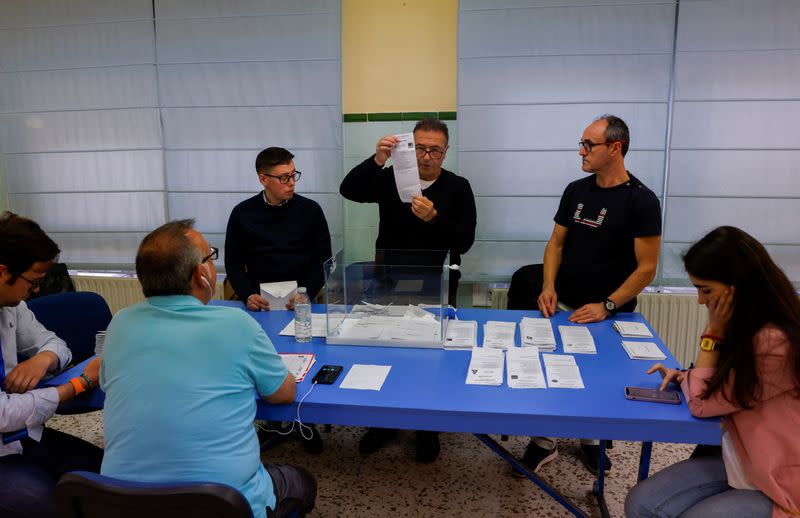 Members of an electoral table count the ballots of the local elections, in Ronda