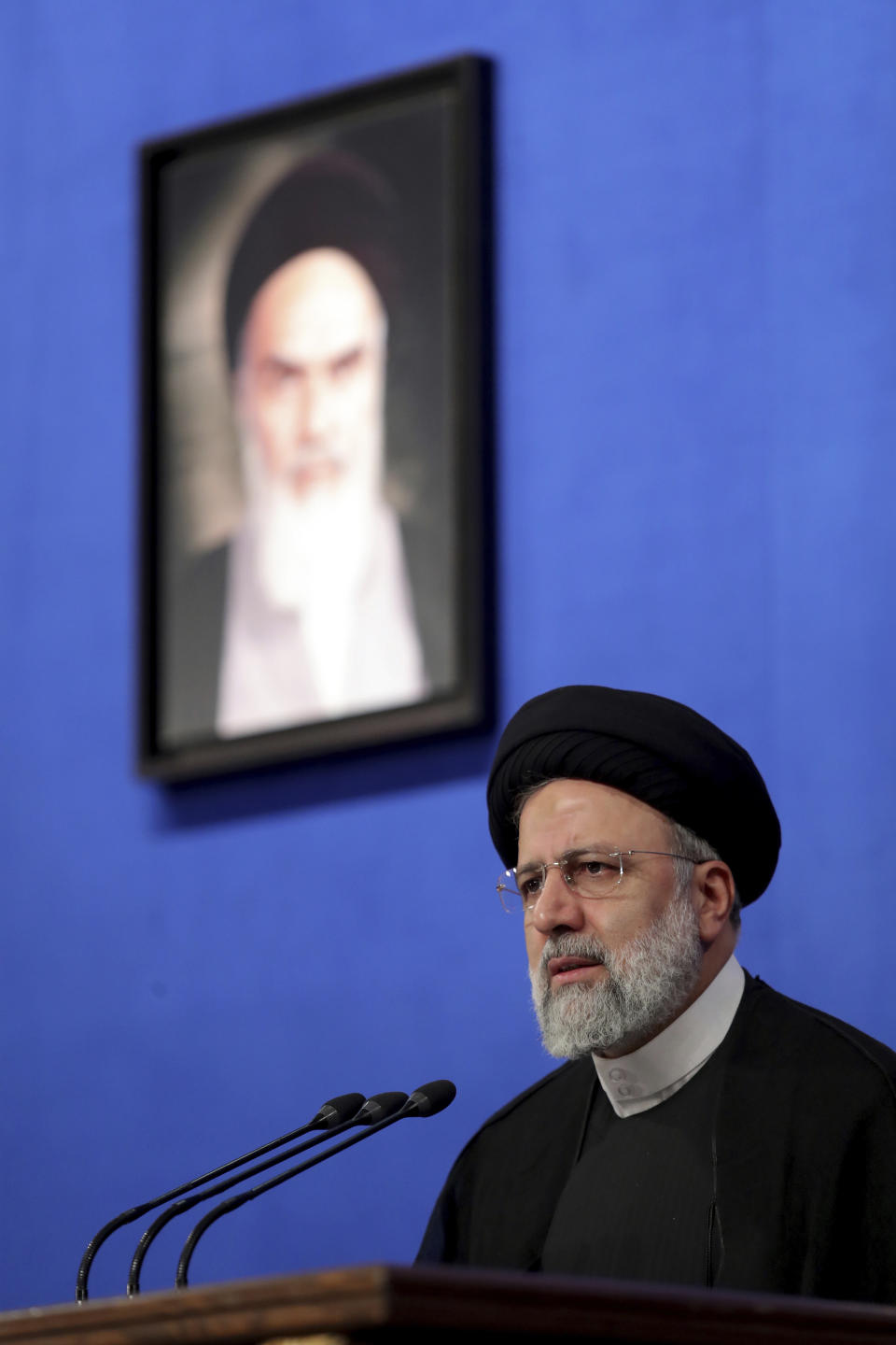 In this photo released by the official website of the office of the Iranian Presidency, President Ebrahim Raisi speaks during his press conference in Tehran, Iran, Monday, Aug. 29, 2022. Raisi warned that any roadmap to restore Tehran's tattered nuclear deal with world powers must see international inspectors end their probe on man-made uranium particles found at undeclared sites in the country. (Iranian Presidency Office via AP)