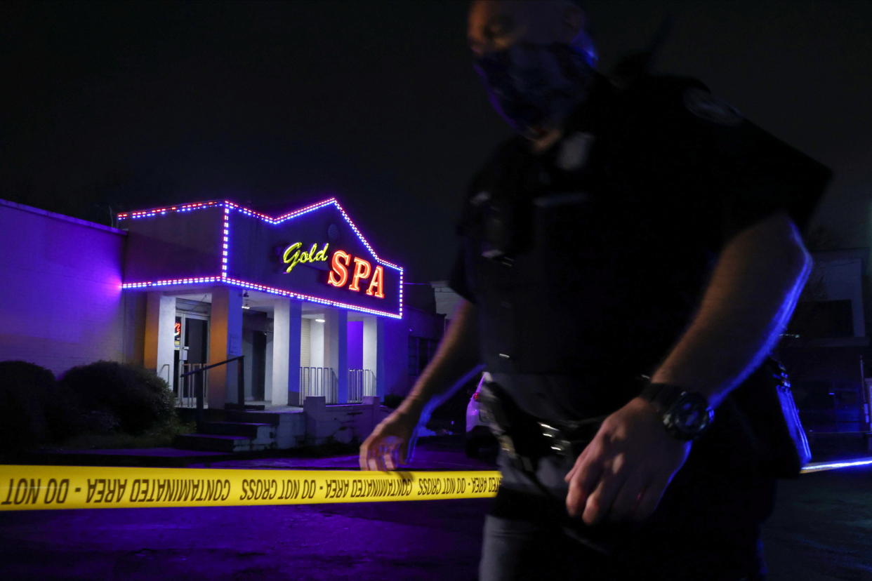 City of Atlanta Police Officer Davis works at the scene outside of Gold Spa after deadly shootings at a massage parlor and two day spas in the Atlanta area, in Atlanta, Georgia, U.S. March 16, 2021.    REUTERS/Chris Aluka Berry