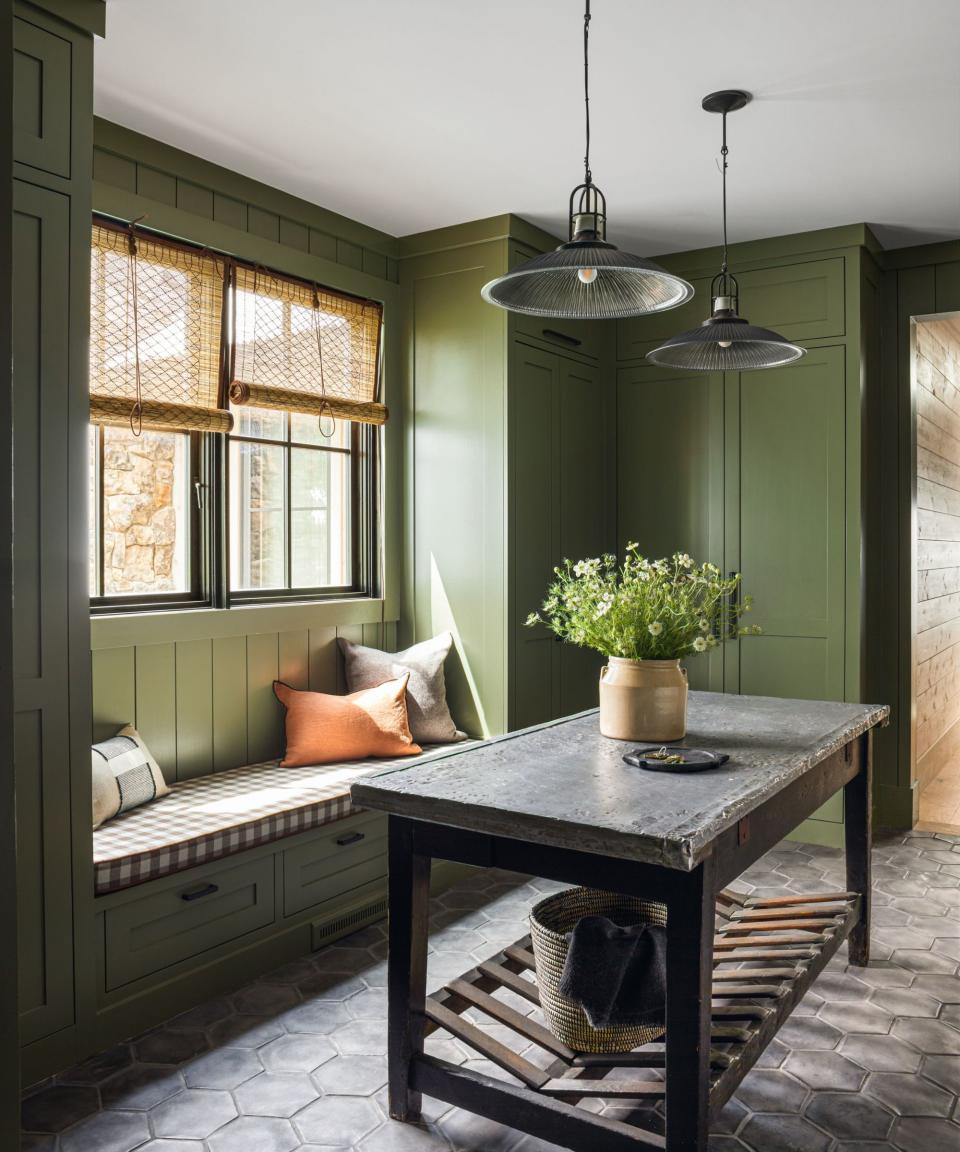 Green cupboards, bench, black table