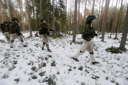 An Estonian army conscript soldiers attend a tactical training in the military training field near Tapa, Estonia February 16, 2017. Picture taken February 16, 2017. REUTERS/Ints Kalnins