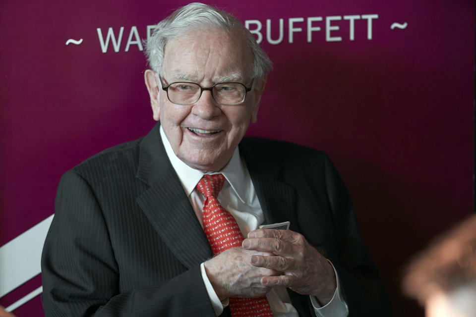 FILE - In this May 5, 2019, file photo Warren Buffett, Chairman and CEO of Berkshire Hathaway, smiles as he plays bridge following the annual Berkshire Hathaway shareholders meeting in Omaha, Neb. Buffett will spend Saturday afternoon fielding questions at Berkshire Hathaway's annual meeting, which is being held virtually. (AP Photo/Nati Harnik, File)