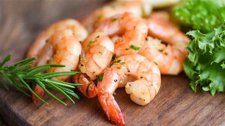 pile of shrimp on wood