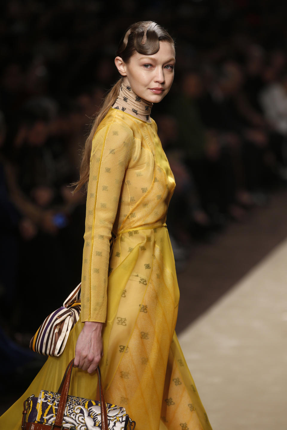 Model Gigi Hadid wears a creation as part of the Fendi women's Fall-Winter 2019-2020 collection, that was presented in Milan, Italy, Thursday, Feb.21, 2019. (AP Photo/Antonio Calanni)