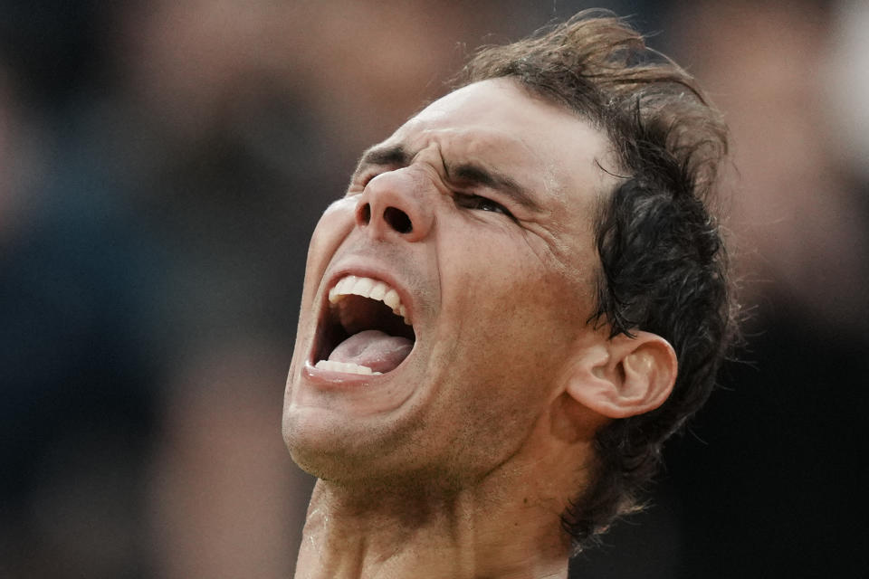 Spain's Rafael Nadal celebrates winning against Canada's Felix Auger-Aliassime in five sets, 3-6, 6-3, 6-2, 3-6, 6-3, during their fourth round match at the French Open tennis tournament in Roland Garros stadium in Paris, France, Sunday, May 29, 2022. (AP Photo/Thibault Camus)