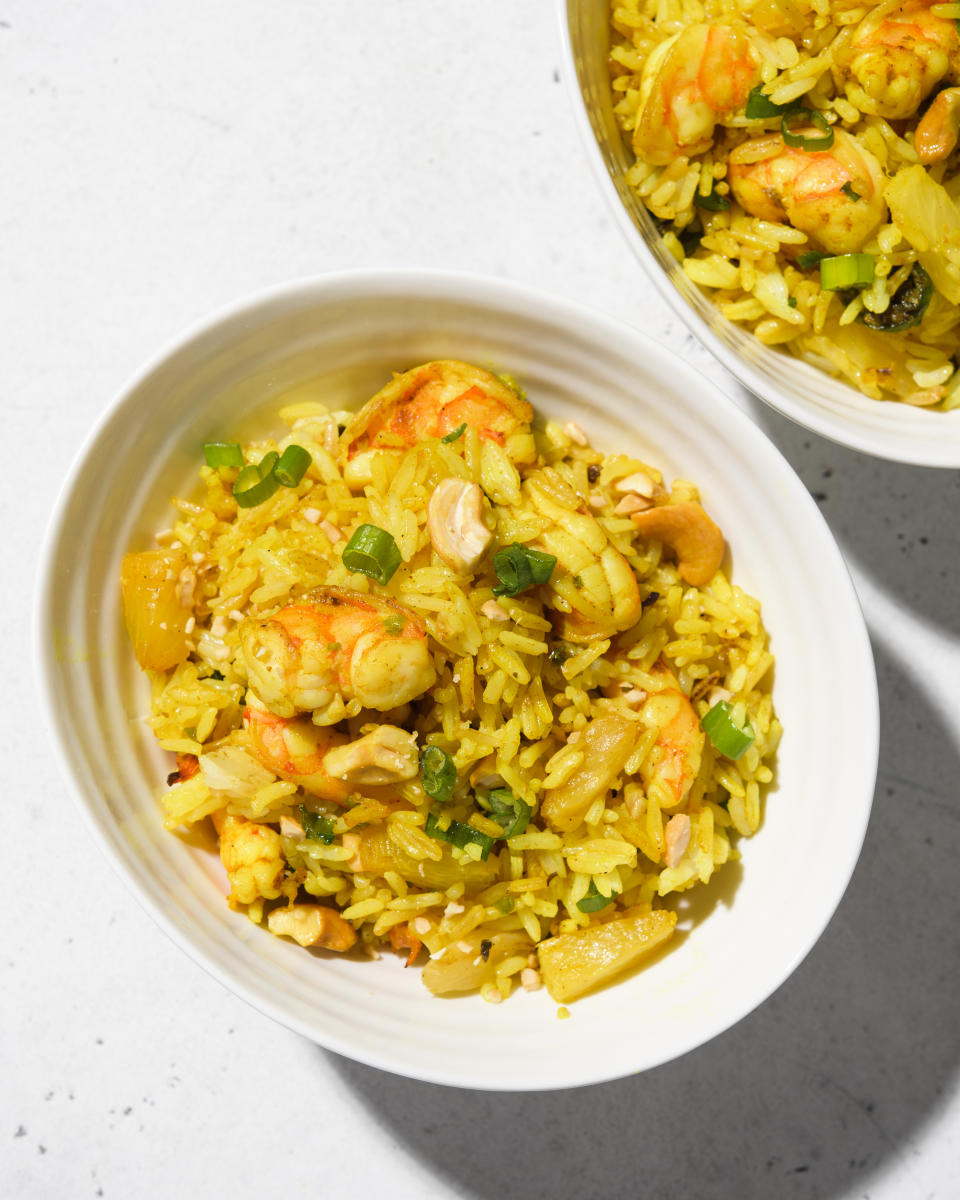 This image released by Milk Street shows a recipe for curried fried rice with shrimp and pineapple. (Milk Street via AP)