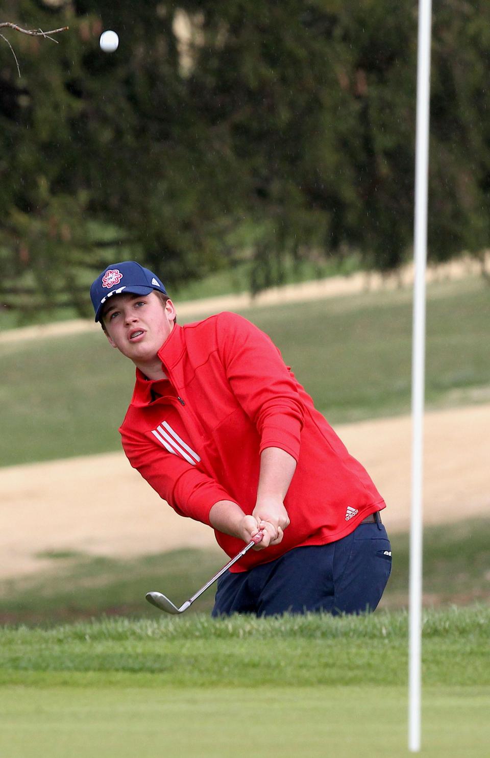 Bedford North Lawrence golfer Jett Jones chips onto the 4th green at Otis Park on Thursday, April 7, 2022 in the match with Bloomington South.