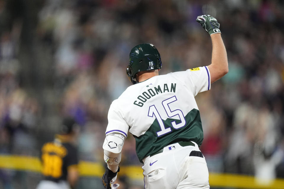 Colorado Rockies' Hunter Goodman gestures as he runs the bases on a two-run home run off Pittsburgh Pirates relief pitcher Justin Bruihl during the seventh inning of a baseball game Saturday, June 15, 2024, in Denver. (AP Photo/David Zalubowski)