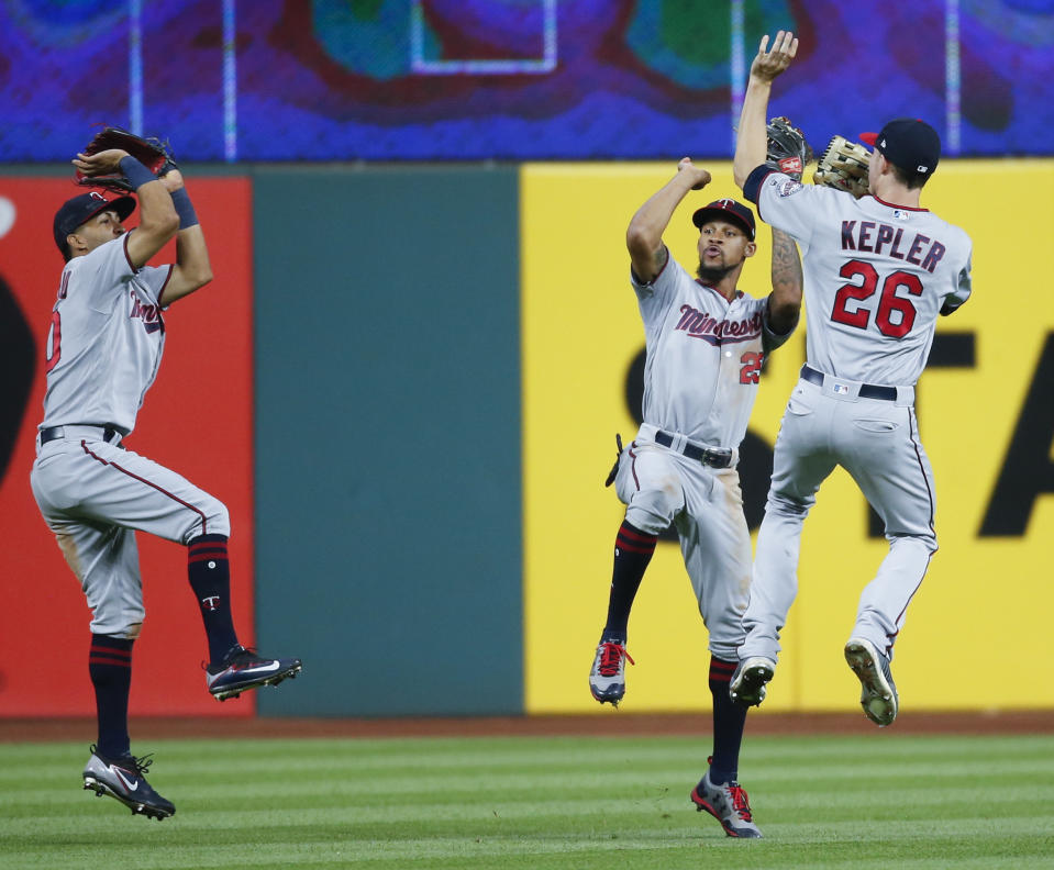 Minnesota Twins’ Eddie Rosario, left, Byron Buxton, center, and Max Kepler celebrate a victory over the Cleveland Indians. (AP)