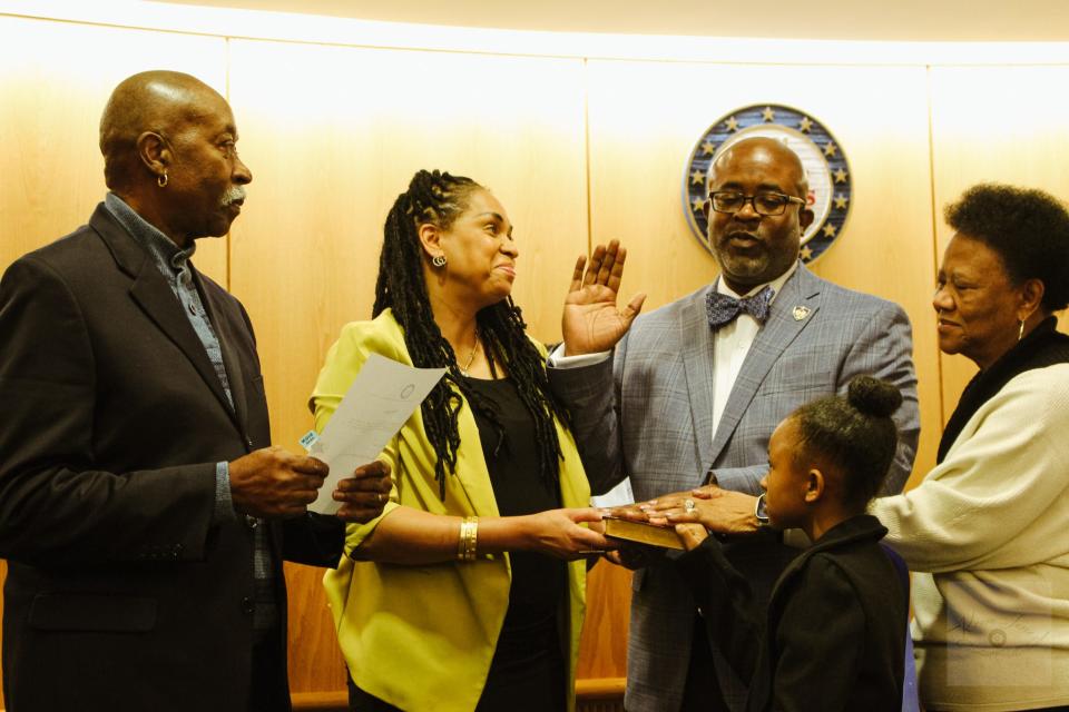 Chancer McLaughlin, second from right, is sworn in as the town manager of Hope Mills on Monday, Feb. 5, 2024. He is joined by his father, Robert McLaughlin, wife, Lavondra McLaughlin, daughter, Madison, and mother, Linda McLaughlin.  Chancer McLaughlin is the first Black town manager in Hope Mills history. He has served as the interim town manager since Scott Meszaros resigned in February 2023.