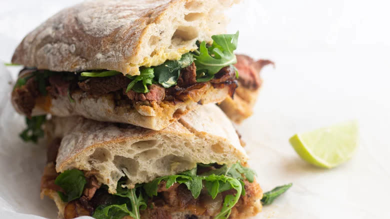 Steak and arugula ciabatta sandwich