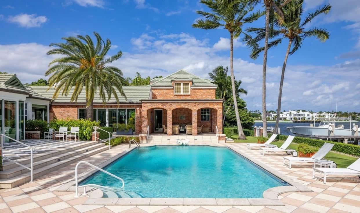 Remodeled and expanded by sellers Bob Vila and Diana Barrett, a house listed for $52.9 million has a lakefront swimming pool at 690 Island Drive in Palm Beach.