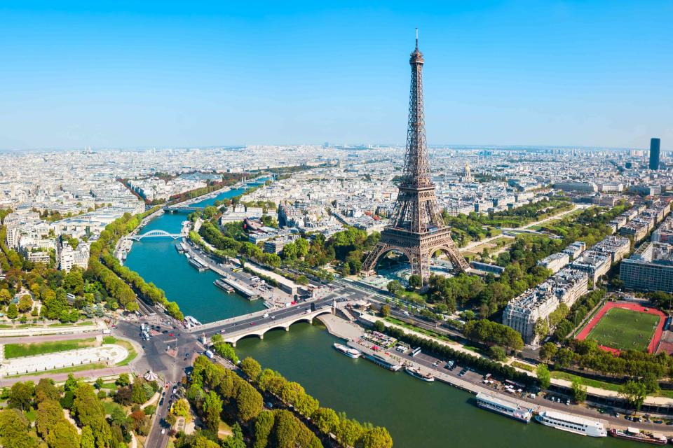 <p>saiko3p/Getty Images</p> The Eiffel Tower on the Champ de Mars in Paris, France