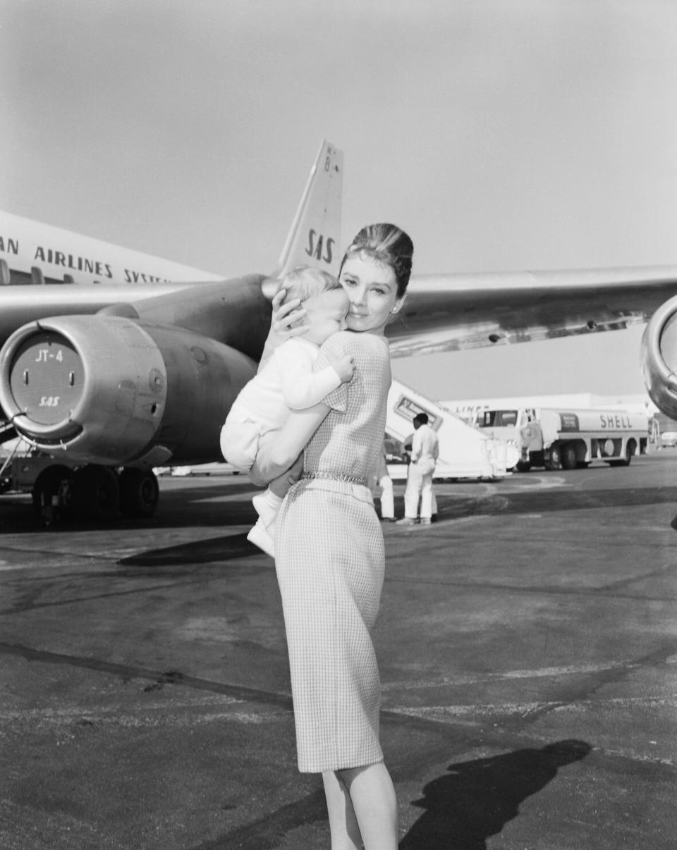 Actress Audrey Hepburn and son Sean, 7 months, leave for Rome via jetliner; February 21, 1961.