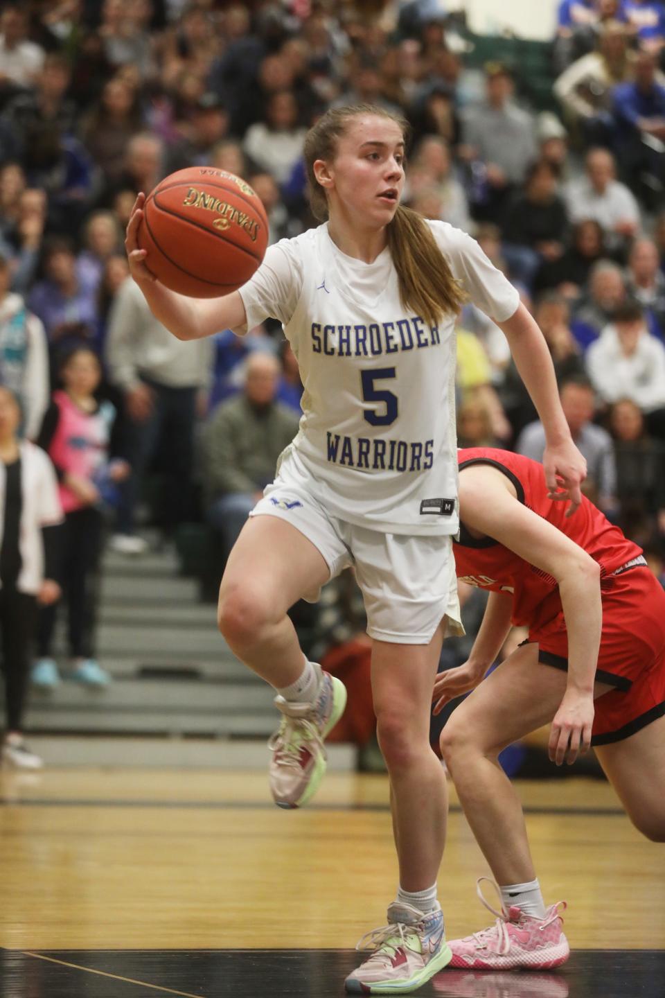 Addison Morgan grabs the rebound and tosses it back before it goes out of bounds.  