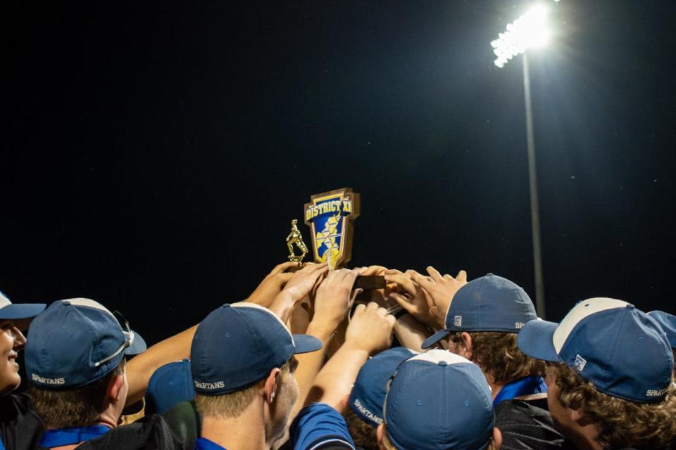 Southern Lehigh baseball players lift the District 11 Class 5A championship trophy at DeSales University's Weiland Park in Center Valley on Tuesday, May 31, 2022. Southern Lehigh defeated Pocono Mountain East, 5-2.