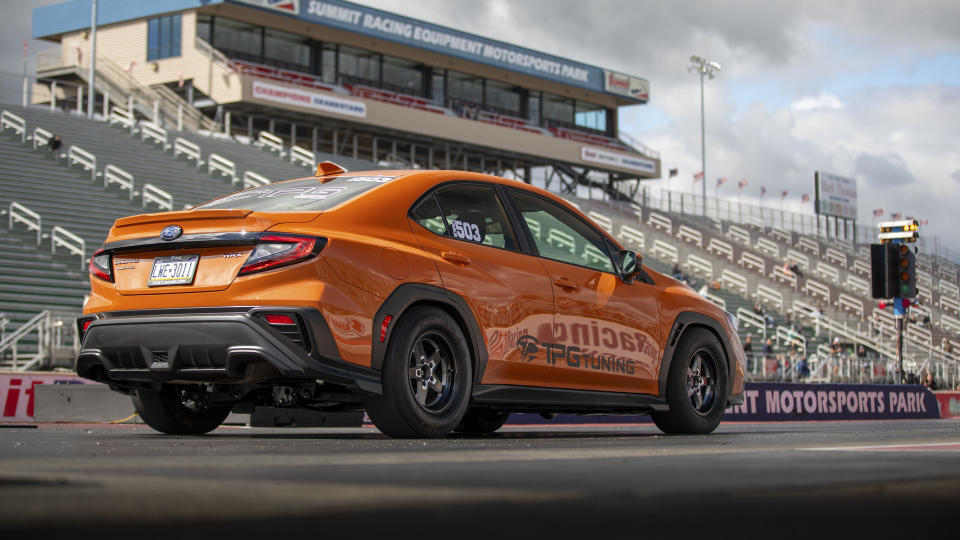 Subaru WRX about to launch on a drag strip.