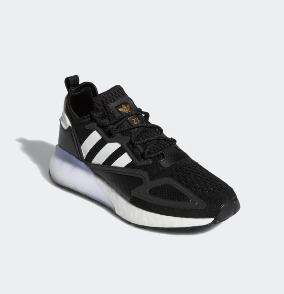 ZX 2K Boost Shoes in black fabric with white stripes and white bottom (Photo via Adidas)