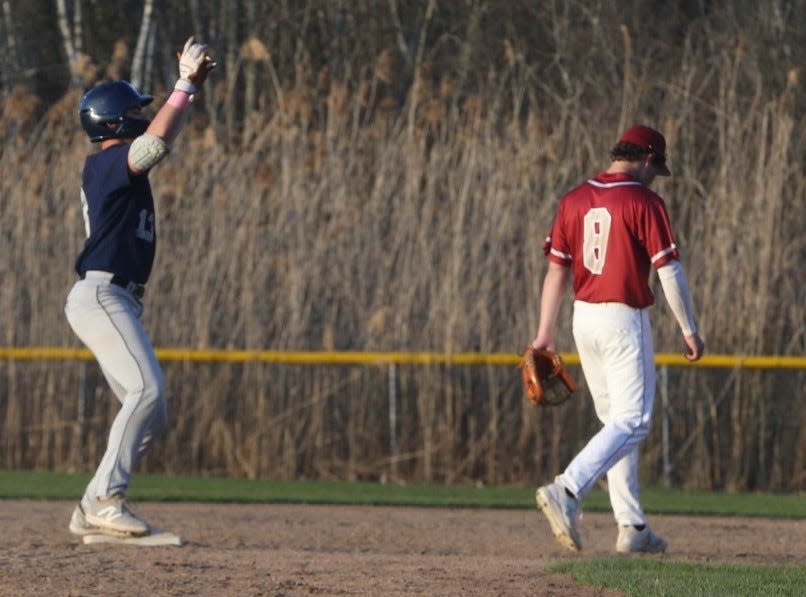 Exeter's Shea LaFleur reacts after his RBI double in the seventh gave the Blue Hawks a 3-2 lead over Portsmouth in Monday's Division I baseball game.