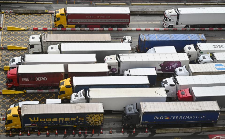 Trucks line up to embark on a ferry at the entrance of the Port of Dover, England