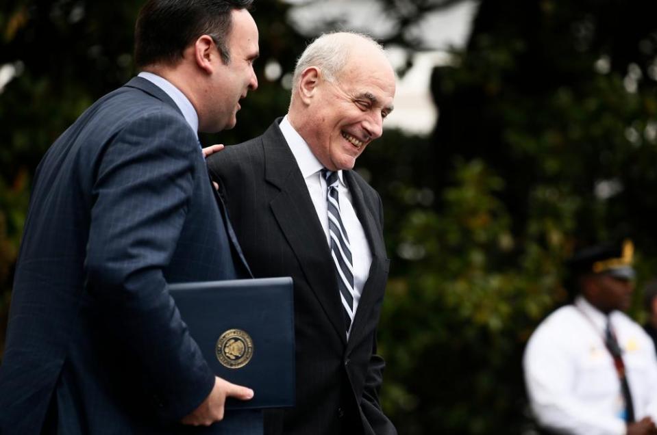 White House Chief of Staff John Kelly, right, laughs with social media director Dan Scavino.