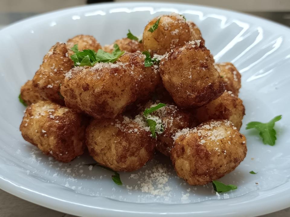 Tater tots with sprigs of parsley