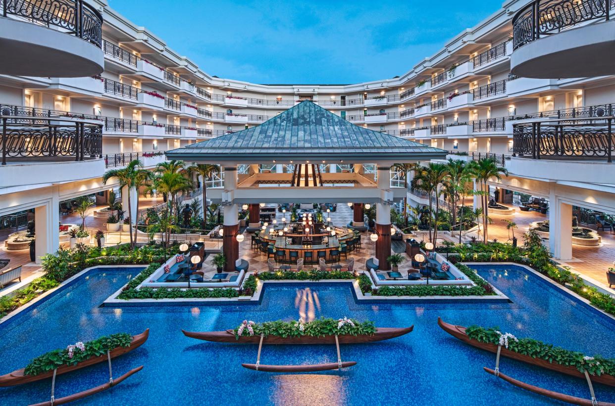 Canoes filled with lush plants bring a flair of Hawaii to the guests who enter the lobby.