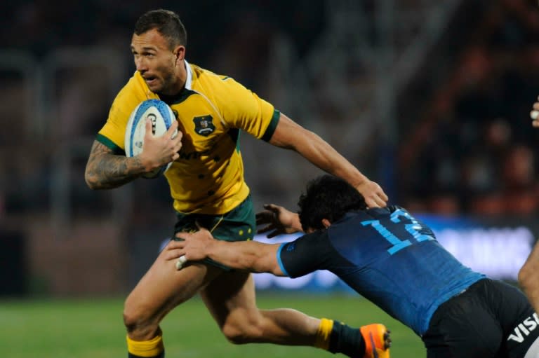 Australia's Wallabies' Quade Cooper (left) is tackled by Argentina's Los Pumas' Juan Pablo Socino during the Rugby Championship 2015 test match at Malvinas Argentinas stadium in Mendoza on July 25, 2015