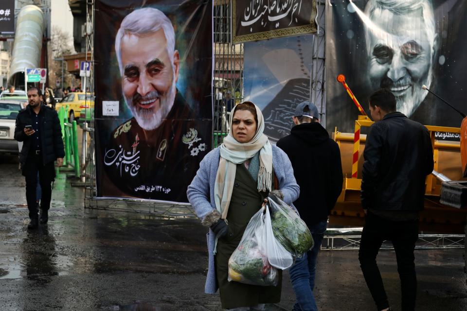 Pedestrians walk past banners of Iranian Revolutionary Guard Gen. Qassem Soleimani, who was killed in Iraq in a U.S. drone attack on Friday, in Tajrish square in northern Tehran, Iran, Thursday, Jan. 9, 2020. Many Iranians say they are relieved that neither their country nor the United States appear primed right now for a more direct military confrontation that could lead to war. (AP Photo/Vahid Salemi)