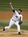 Chicago White Sox starting pitcher Erik Johnson delivers during the third inning of a baseball game against the Boston Red Sox on Tuesday, April 15, 2014, in Chicago. (AP Photo/Charles Rex Arbogast)