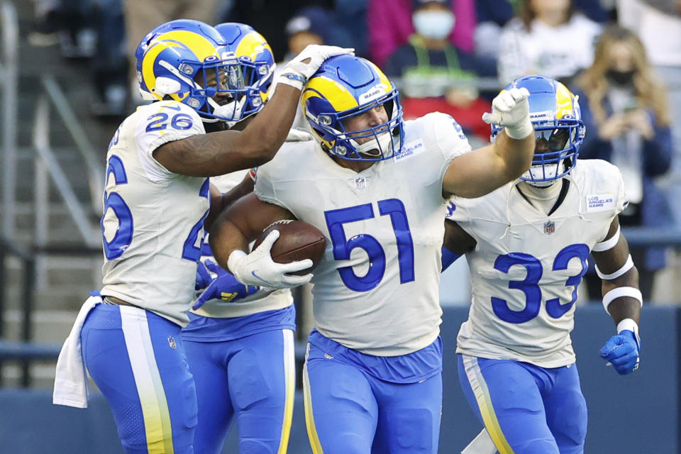 Los Angeles Rams linebacker Troy Reeder (51) celebrates after he intercepted a pass against the Seattle Seahawks during the first half of an NFL football game, Thursday, Oct. 7, 2021, in Seattle. (AP Photo/Craig Mitchelldyer)