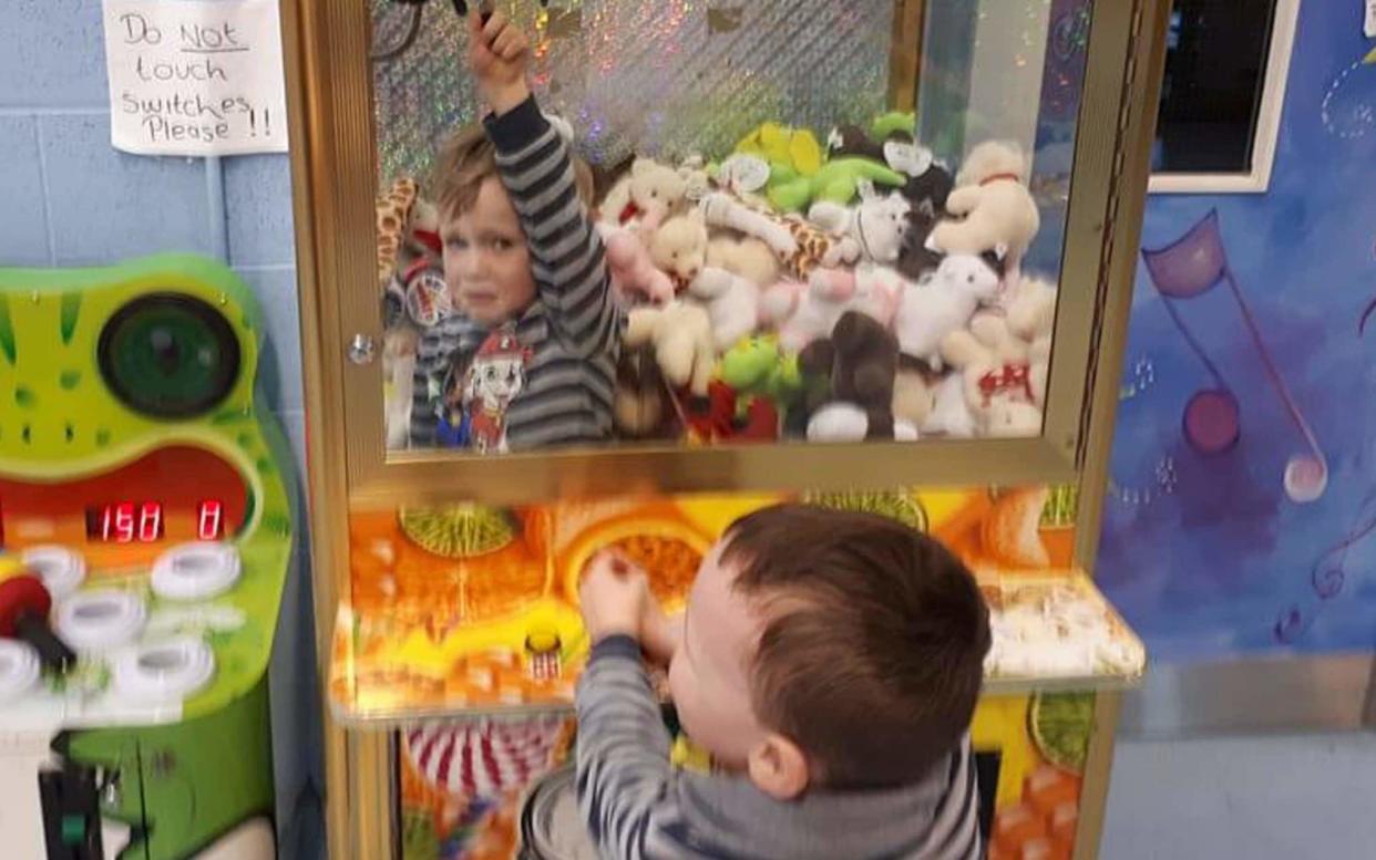 The three-year-old became trapped in the machine - PA