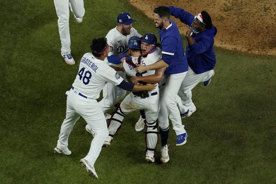 Los Angeles Dodgers celebrate after defeating the Tampa Bay Rays 3-1 to win the baseball World Series in Game 6 Tuesday, Oct. 27, 2020, in Arlington, Texas. (AP Photo/David J. Phillip)