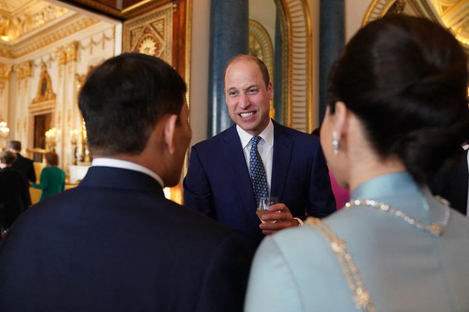 Prince William speaking with guests at the evening reception