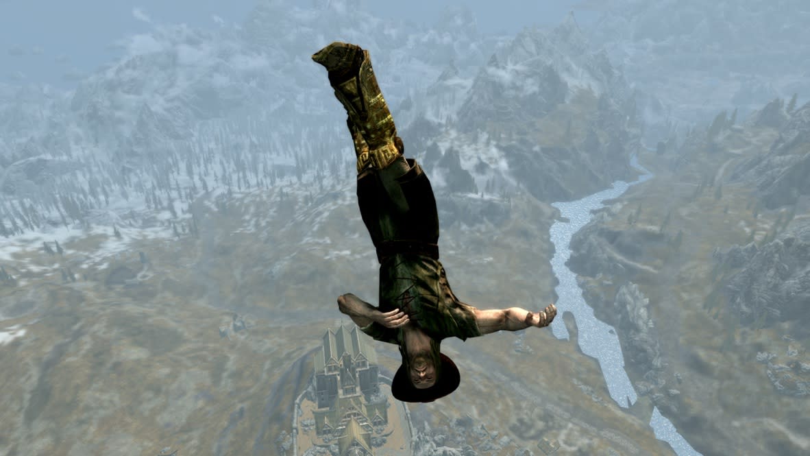  A nord in a cowboy hat lingers upside-down, thousands of feet above the ground in Skyrim. 