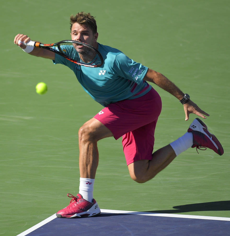Stan Wawrinka, of Switzerland, hits to Roger Federer, of Switzerland, during the men's final at the BNP Paribas Open tennis tournament, Sunday, March 19, 2017, in Indian Wells, Calif. (AP Photo/Mark J. Terrill)
