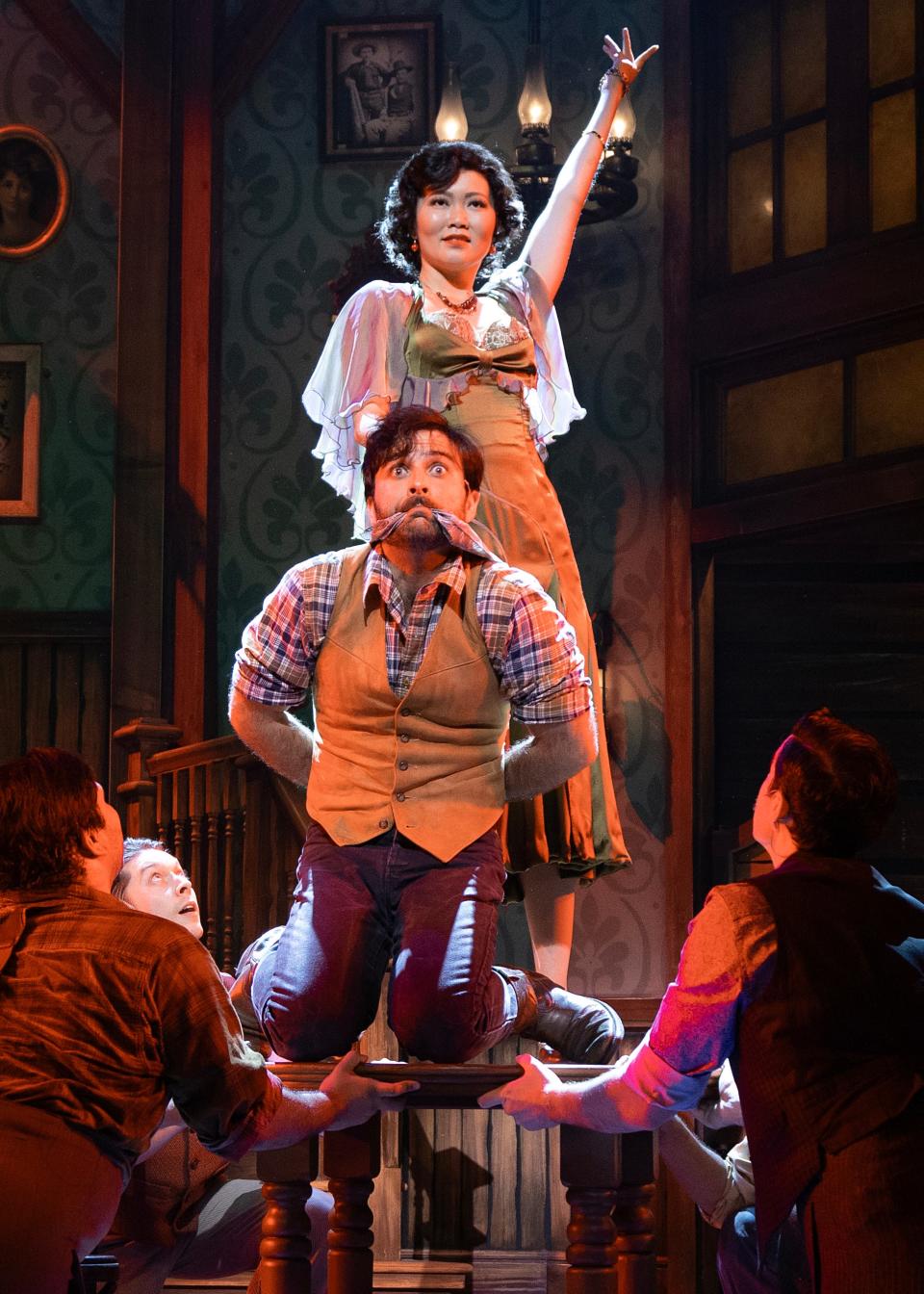 Candice Hatakeyama, top, as Irene, and Barrett Riggins as Lank, develop an unexpected relationship in “Crazy for You” at Asolo Repertory Theatre.