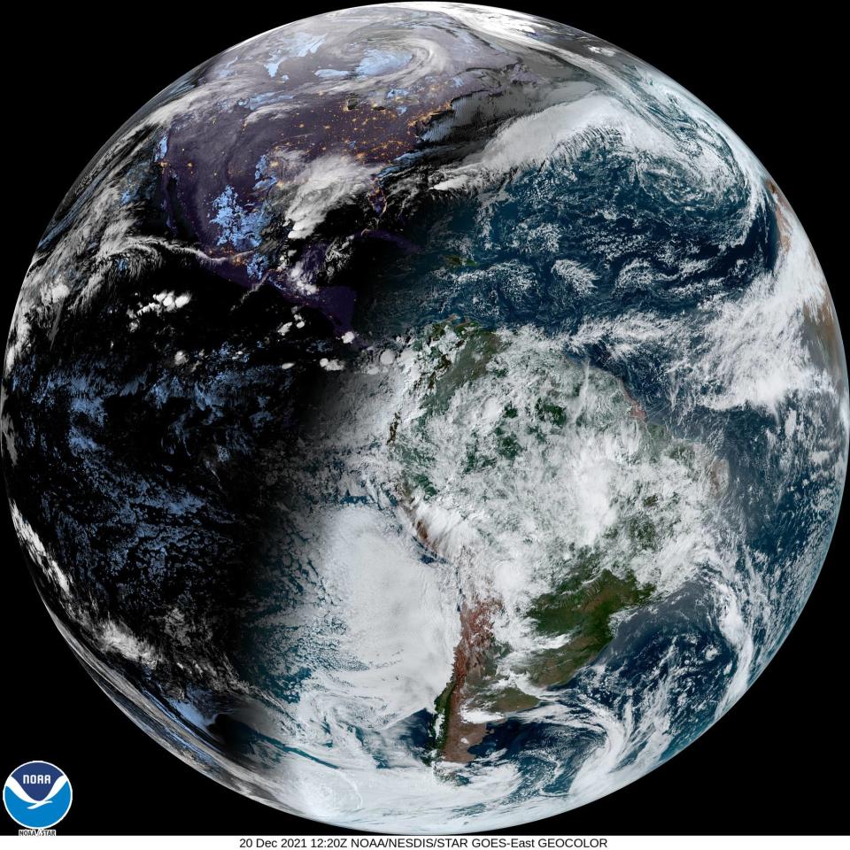 A day before Tuesday's winter solstice, this satellite photo shows how much more sunlight the Southern Hemisphere receives at this time of year. North America is at the top in shadow.