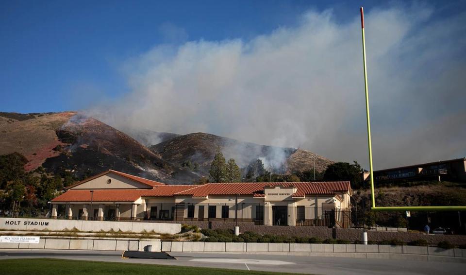 A fire burns the hillside off Lizzie Street behind San Luis Obispo High School on Monday, Oct. 30, 2023.