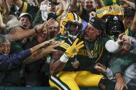 Green Bay Packers' Aaron Jones celebrates his touchdown run during the second half of an NFL football game against the Detroit Lions Monday, Sept. 20, 2021, in Green Bay, Wis. (AP Photo/Matt Ludtke)