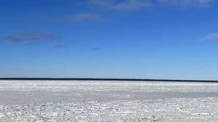 Off the coast of Rimouski, Que., the St. Lawrence River flows without ice. The ice along the banks is not thick enough to fish from. (Marie-Christine Rioux/Radio-Canada - image credit)