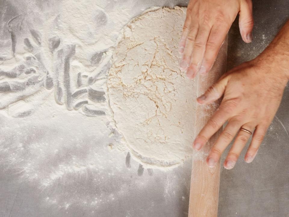 Roll the chilled pastry on a floured surface to 4mm to 5mm thick and to suit the size and shape of your cooking dish (Joe Woodhouse)
