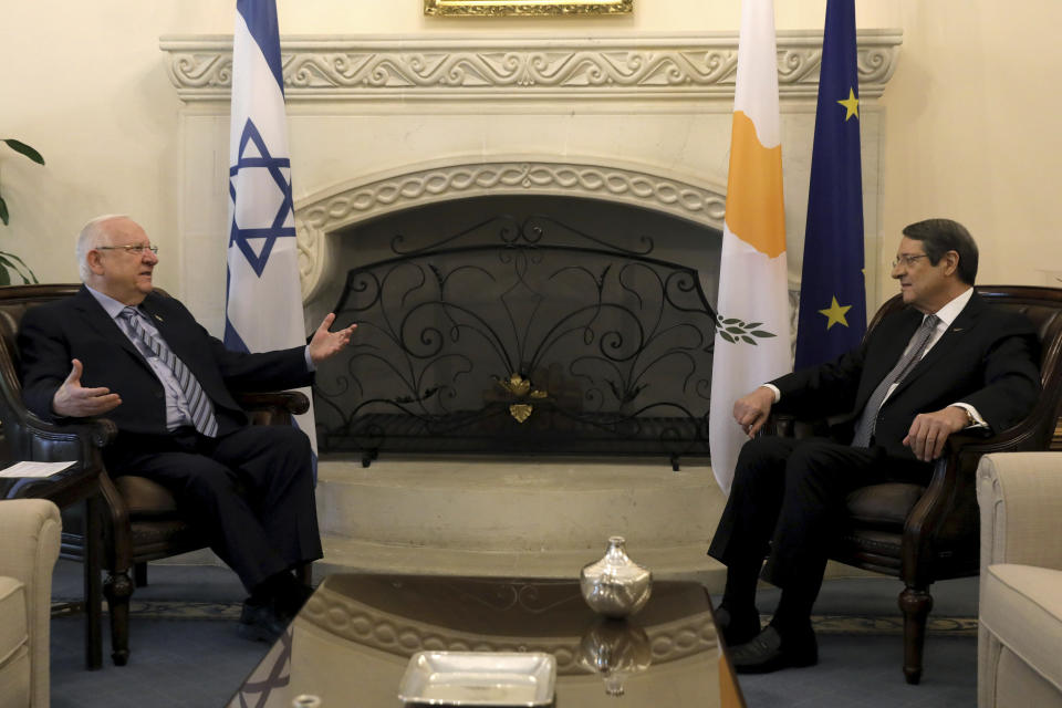 Cyprus' president Nicos Anastasiades, right, and Israel's President Reuven Rivlin talk during their meeting at the presidential palace in divided capital Nicosia, Cyprus, on Tuesday, Feb. 12, 2019. Rivlin is in Cyprus for a one-day official visit for talks. (Yiannis Kourtoglou/Pool via AP)