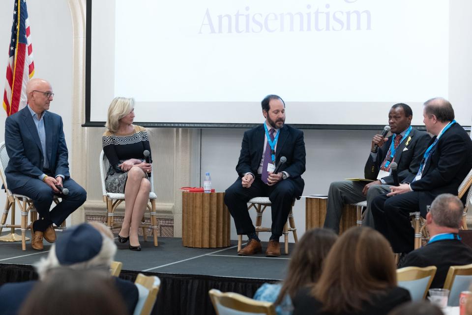 The "Crisis on Campus: What Can Be Done?" panel included moderator Ben Trachtenberg, center, and panelists Ted Deutch, from left, Kerry Healey, Allen Sessoms and Steven Poskanzer.