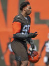 Cleveland Browns defensive end Myles Garrett (95) walks during NFL football practice in Berea, Ohio, Wednesday, July 28, 2021. (AP Photo/David Dermer)