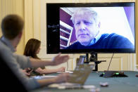 FILE - In this Saturday, March 28, 2020 handout photo provided by Number 10 Downing Street, Britain's Prime Minister Boris Johnson chairs the morning Covid-19 Meeting remotely after self isolating after testing positive for the coronavirus, at 10 Downing Street, London. British Prime Minister Boris Johnson has been admitted to a hospital with the coronavirus. Johnson’s office says he is being admitted for tests because he still has symptoms 10 days after testing positive for the virus. (Andrew Parsons/10 Downing Street via AP, File)